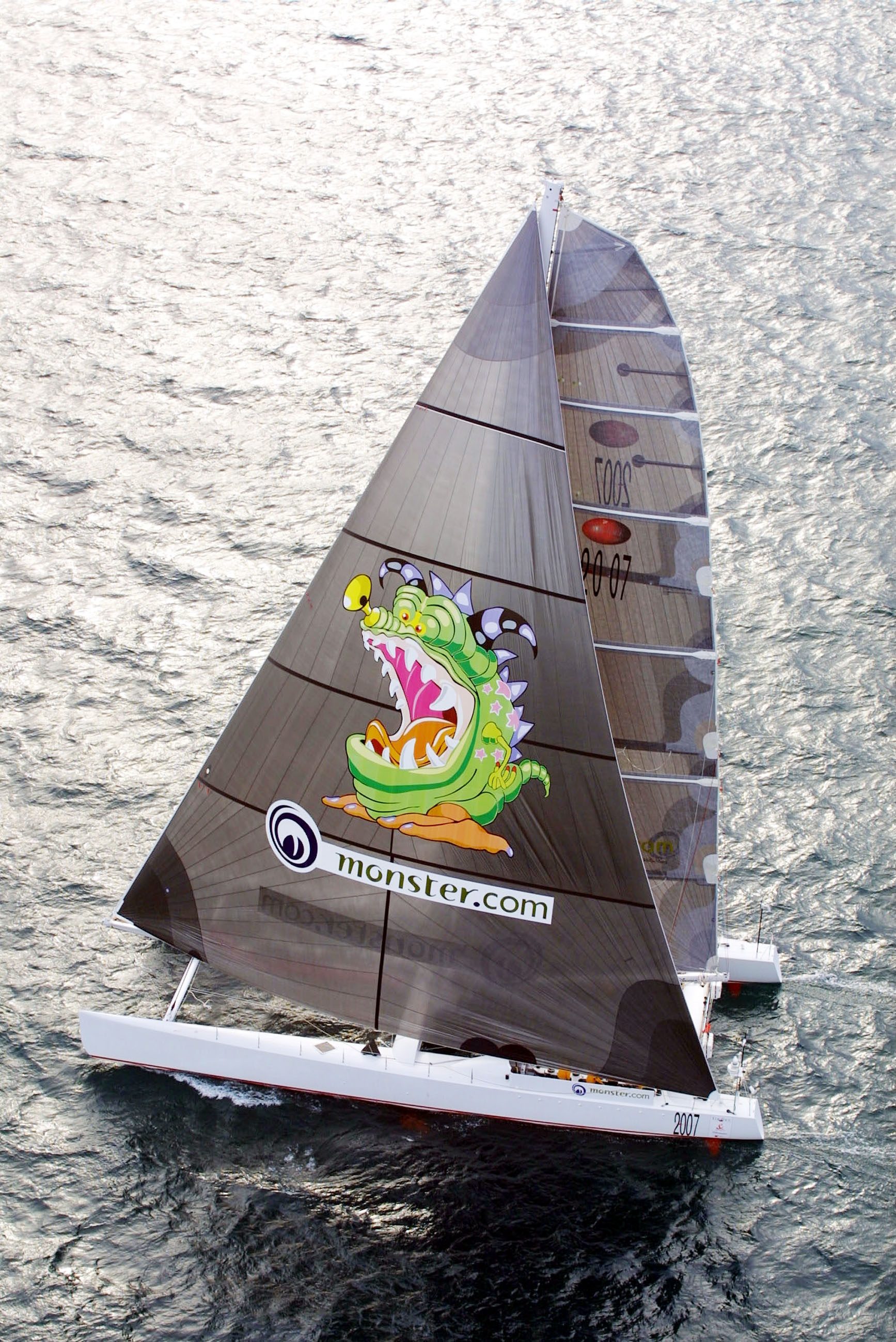 Aerial view of Team Adventure under full sail — Monster.com livery